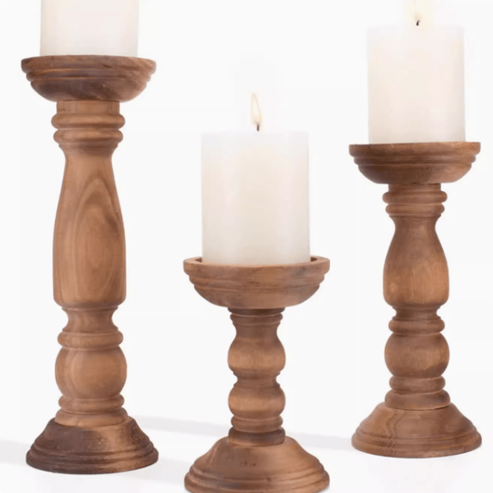 Wabi-Sabi style Paulownia wood vintage candle holders with white candles for a rustic home decor.