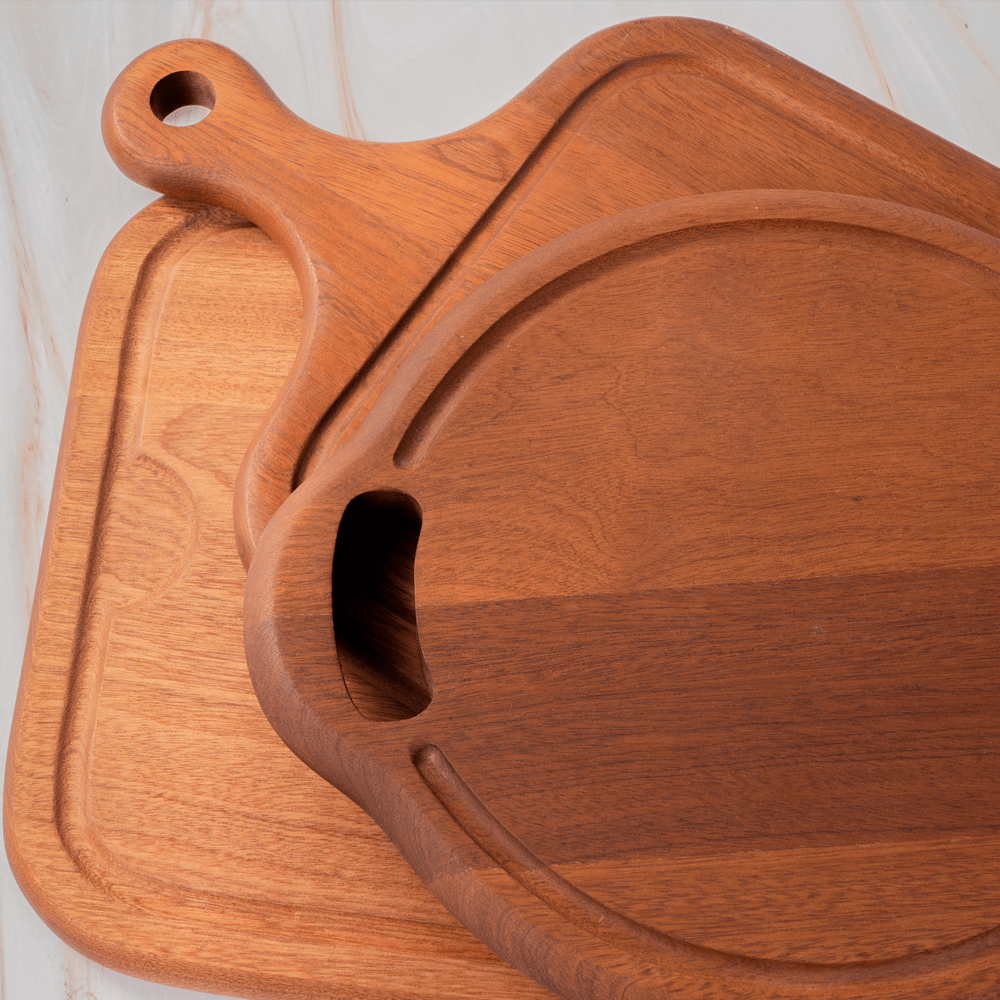 Stylish multi-functional cutting boards featuring a built-in juice groove, perfect for kitchen use and decoration.