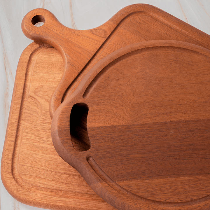 Stylish multi-functional cutting boards featuring a built-in juice groove, perfect for kitchen use and decoration.