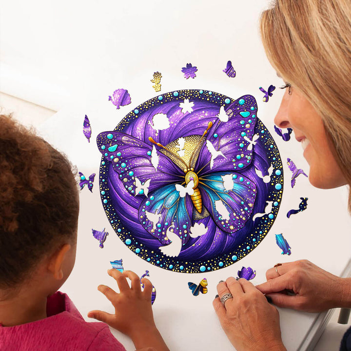 Adult and child enjoying a colorful Seek and Find Butterflies wooden jigsaw puzzle together on a table.