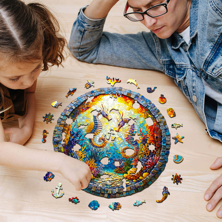 Child and adult enjoying the 3D Seahorses in Harmony wooden jigsaw puzzle, surrounded by colorful puzzle pieces.