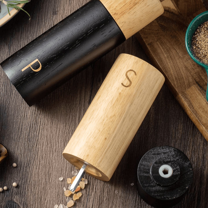 Sea salt and pepper grinder combo set made from natural rubber wood, showcasing elegant design and functionality.