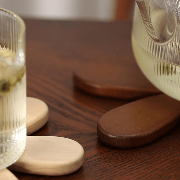 Wooden Christmas tree coasters adding a natural touch to a dining table, showcasing unique wood textures.