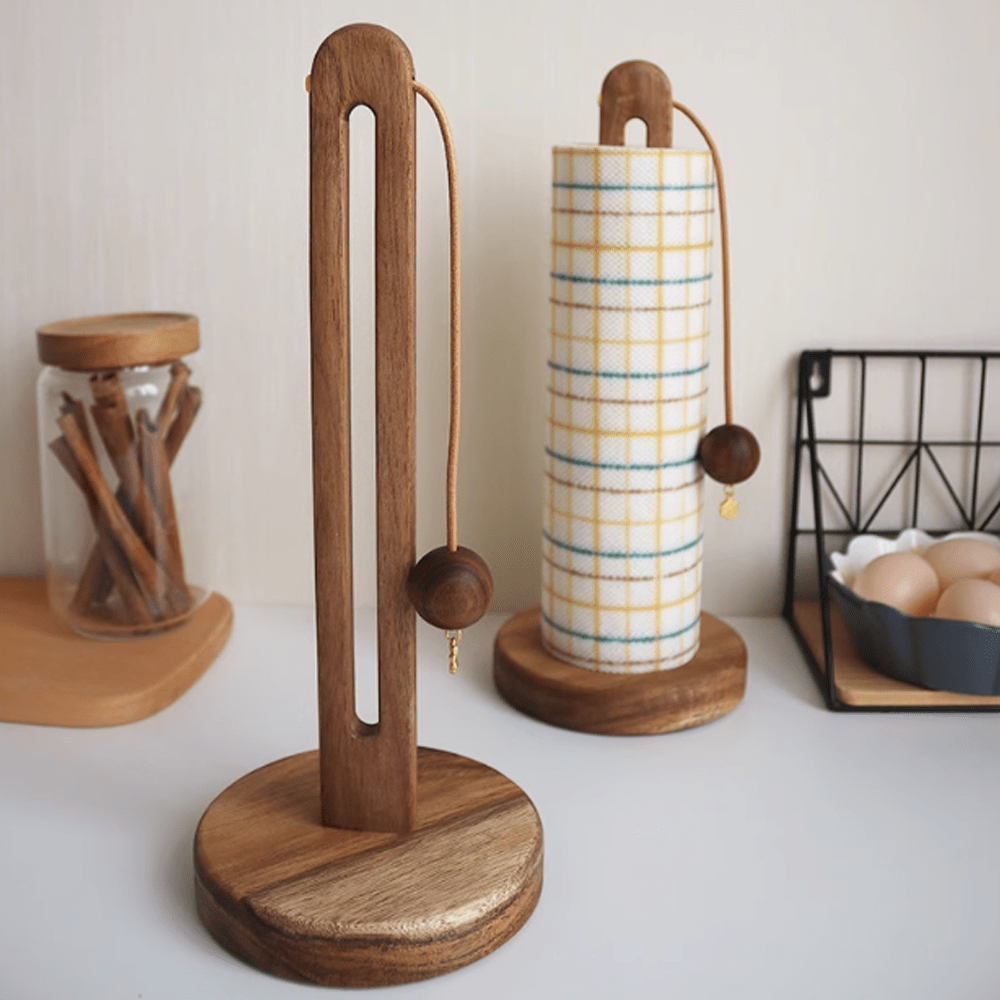 Wooden kitchen paper towel holder in natural wood finish with a decorative wooden ball and anti-scatter rope design.