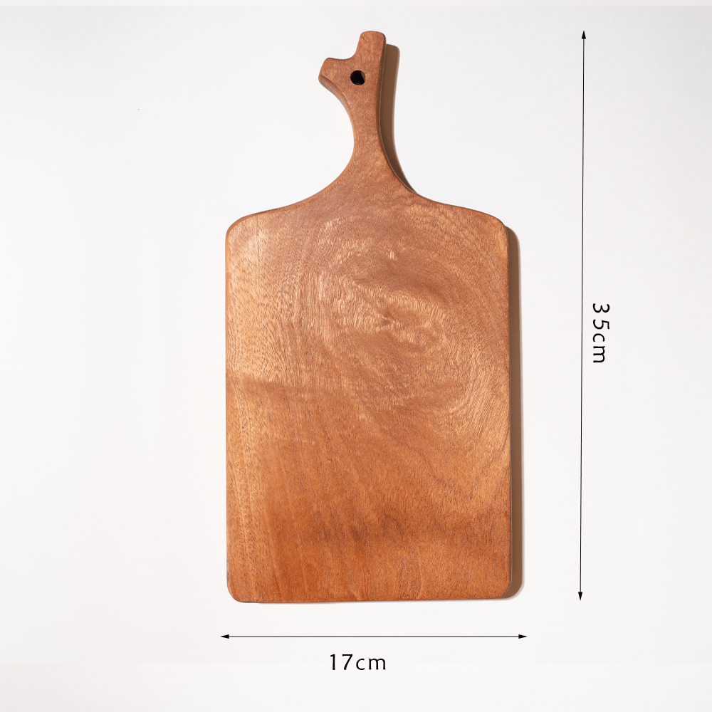 Multi-functional cutting board in branch design, crafted from natural ebony, perfect for chopping and serving.