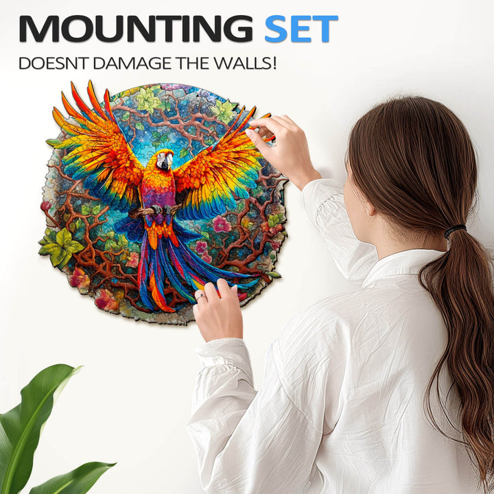 A woman hanging a colorful parrot puzzle on the wall with a mounting set that doesn't damage the surface.