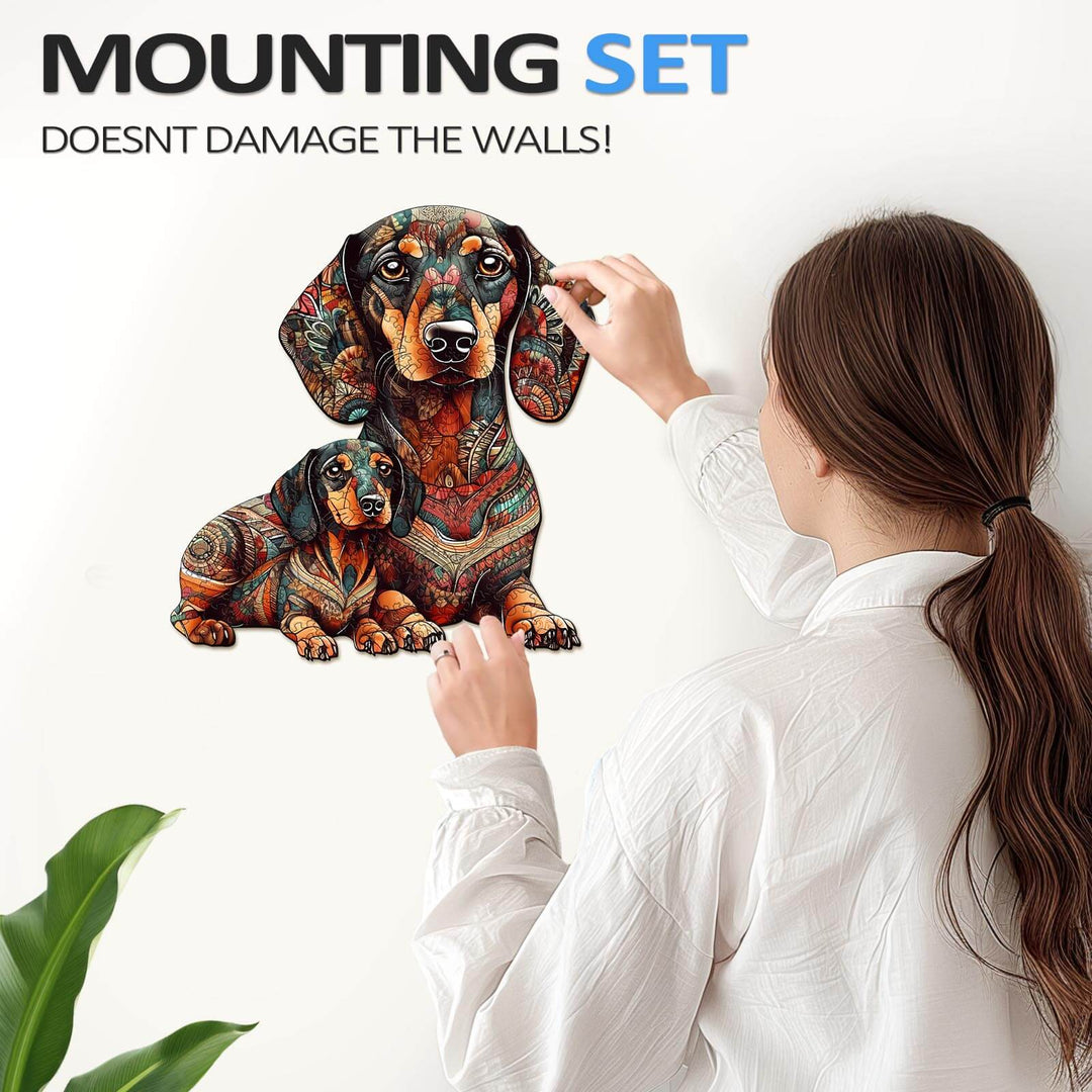 Person applying colorful dachshund wall art, showcasing the mounting set that doesn't damage walls.