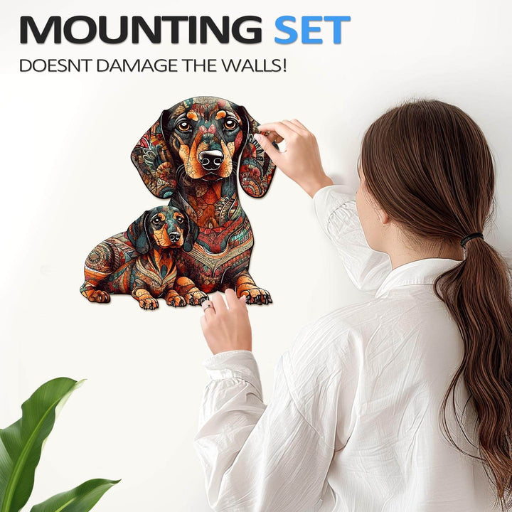 Person applying colorful dachshund wall art, showcasing the mounting set that doesn't damage walls.