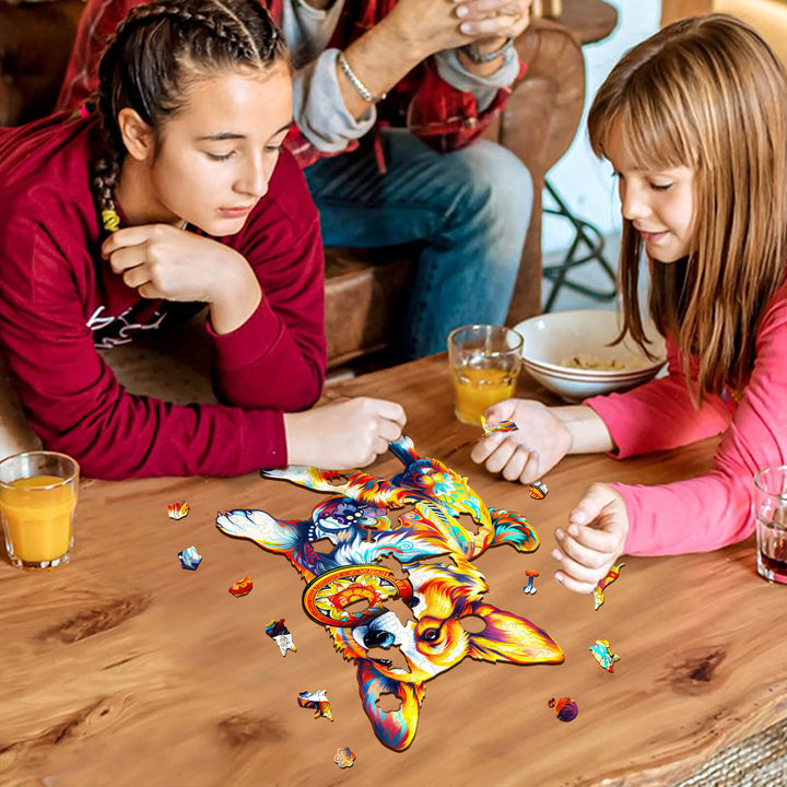 Two girls solving a colorful dog wooden jigsaw puzzle on a table, enjoying a fun brain game together.