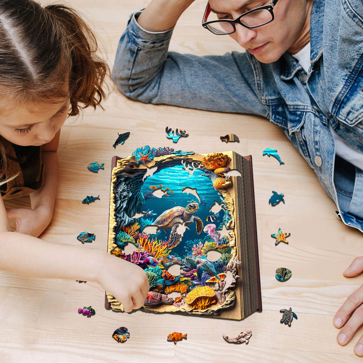 Adult and child enjoying the 3D Deep Blue Wooden Jigsaw Puzzle with colorful ocean life pieces on a wooden table.