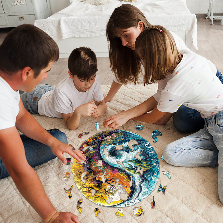 Family enjoying a moment together while assembling a wooden Yin Yang landscape jigsaw puzzle.