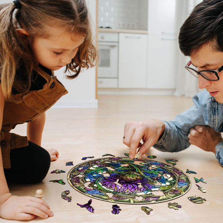 Two people enjoying a Scotch Thistle wooden jigsaw puzzle on the floor, enhancing focus and cognitive skills.