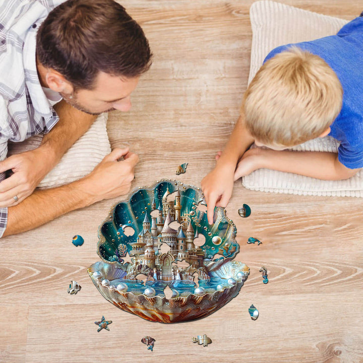 Father and son solving Pearlspire Citadel-2 wooden jigsaw puzzle together on the floor.
