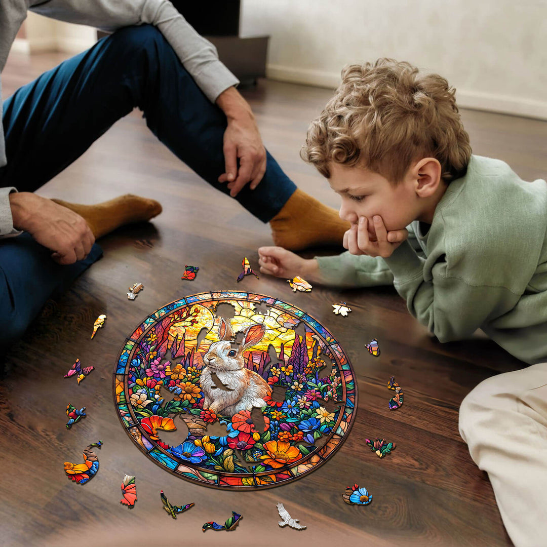 Child and adult assembling a colorful Flower Field Rabbit wooden jigsaw puzzle, engaging in a fun and focused activity.