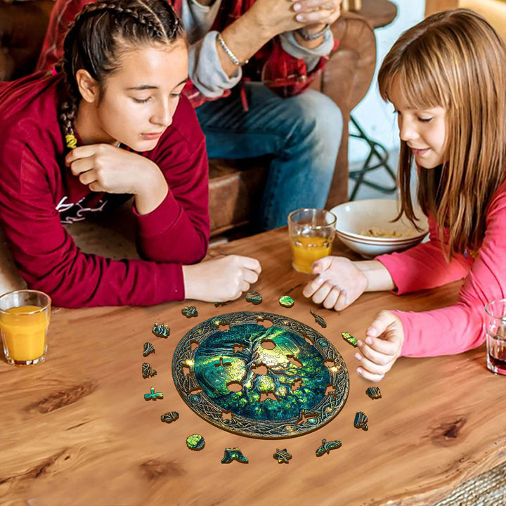 Two girls enjoying the Eternal Tree wooden jigsaw puzzle at home, focusing on puzzle pieces around a round table.
