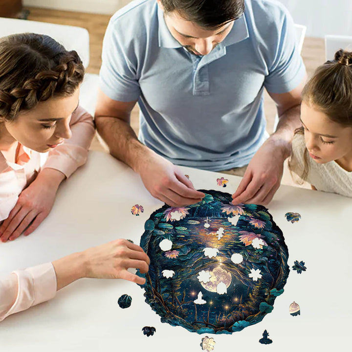 Family enjoying the 3D Cave Moon Lotus wooden jigsaw puzzle together on a table.
