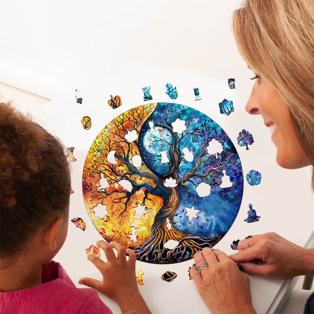 A child and adult assembling the Yin Yang Tree of Life-9 wooden jigsaw puzzle, promoting focus and mental skills.