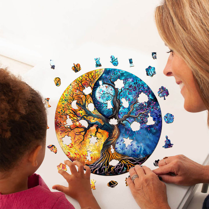 A child and adult assembling the Yin Yang Tree of Life-9 wooden jigsaw puzzle, promoting focus and mental skills.