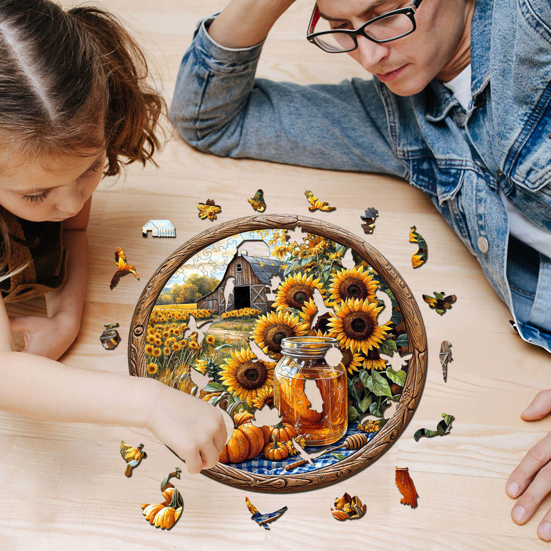 Father and daughter solving a SEEK AND FIND BEES wooden jigsaw puzzle featuring sunflowers and autumn elements.