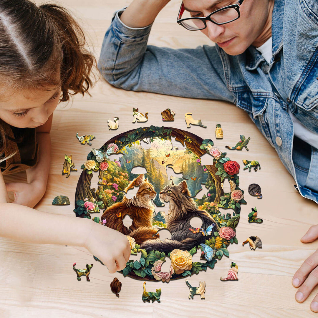Father and daughter assembling the Cats in Love-1 wooden jigsaw puzzle featuring two cats surrounded by flowers.