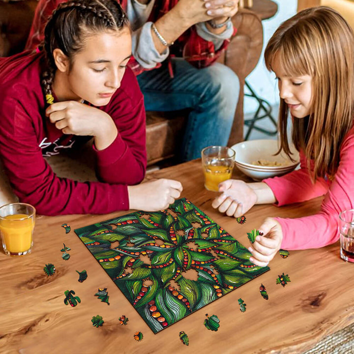 Two girls engaged in play with a vibrant puzzle featuring greens by artist Erin Desjardine, enjoying a cozy indoor setting.