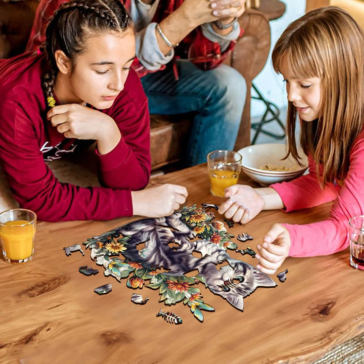 Two children engaged in solving an American Shorthair wooden jigsaw puzzle on a wooden table.