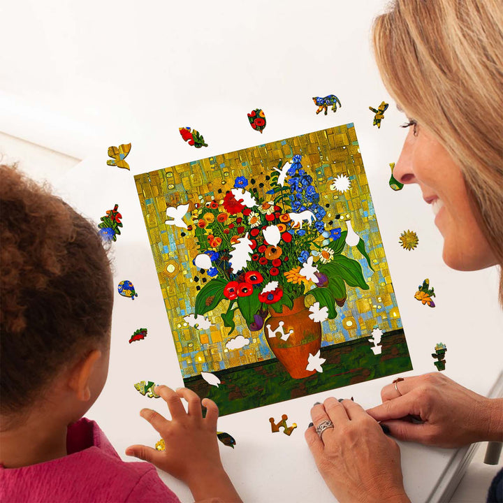 A woman and child working on a colorful puzzle featuring a vase of flowers, promoting creativity and artistic inspiration.