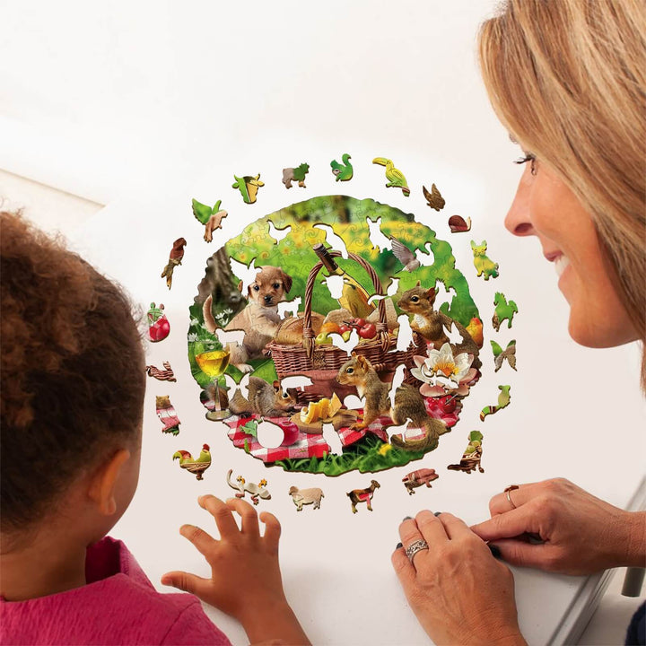 Adult and child enjoying the Animal Picnic wooden jigsaw puzzle, featuring playful animals and vibrant colors.