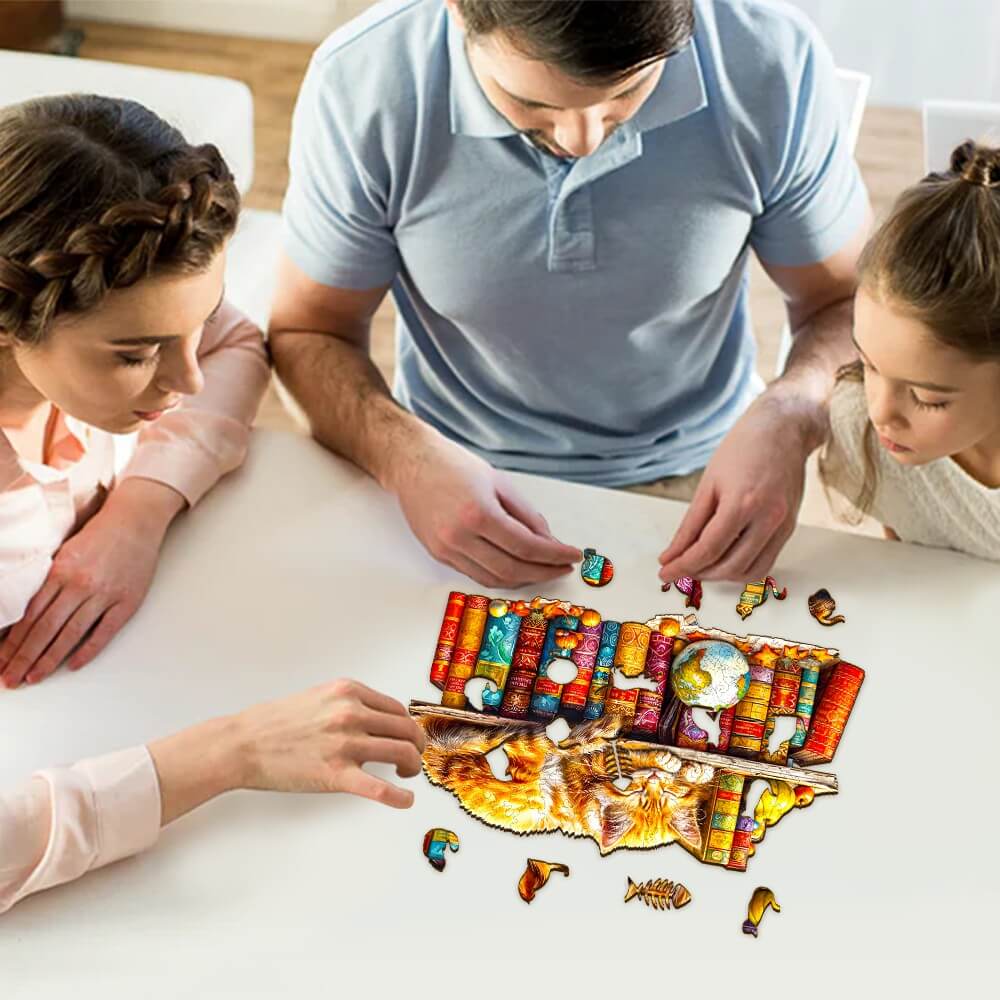 Family enjoying a Dreamy Tabby Cat wooden jigsaw puzzle together at a table.