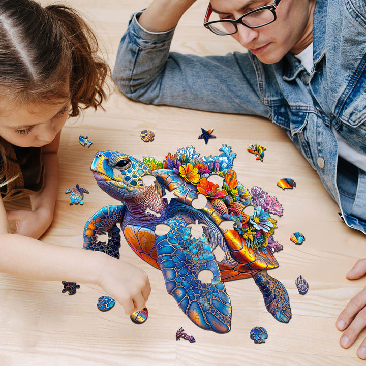 A child and adult playing with a colorful Coral and Turtle wooden jigsaw puzzle on a wooden table.