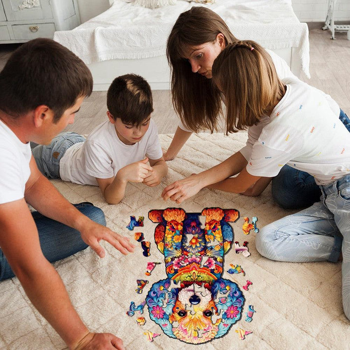 Family enjoying time together assembling a cute poodle wooden jigsaw puzzle on the floor.