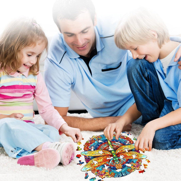 Family enjoying quality time assembling the Mandala Dragonfly 1 wooden jigsaw puzzle on a cozy carpet.