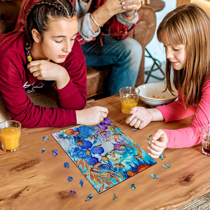 Two girls enjoying a colorful puzzle on a wooden table, surrounded by drinks, perfect for family bonding and creativity.