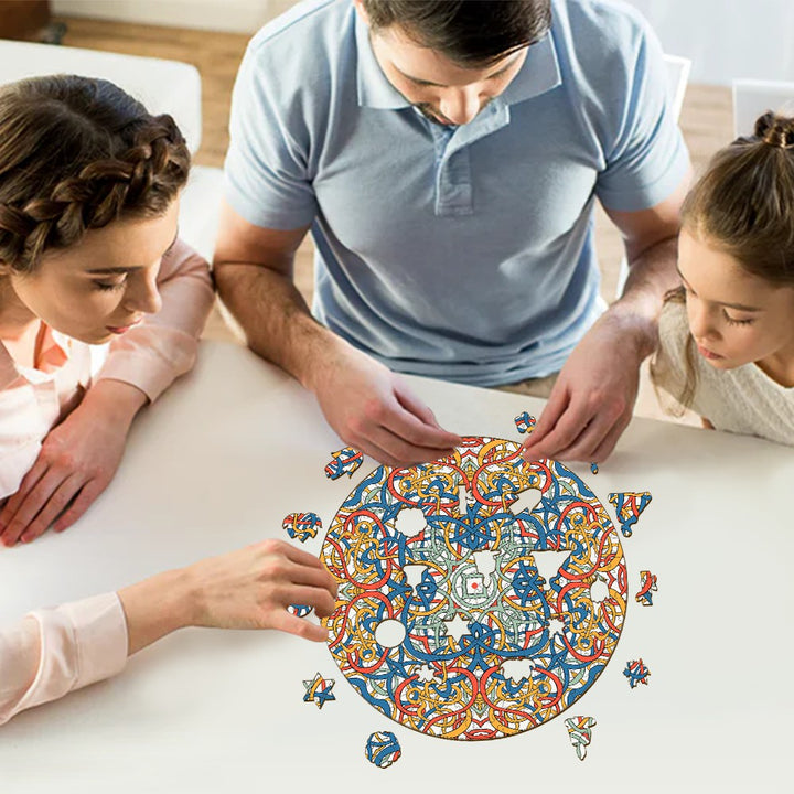 Family enjoying a puzzle of Mandala Celtic Chaos by Lori Anne McKague, featuring colorful intricate doodle art.