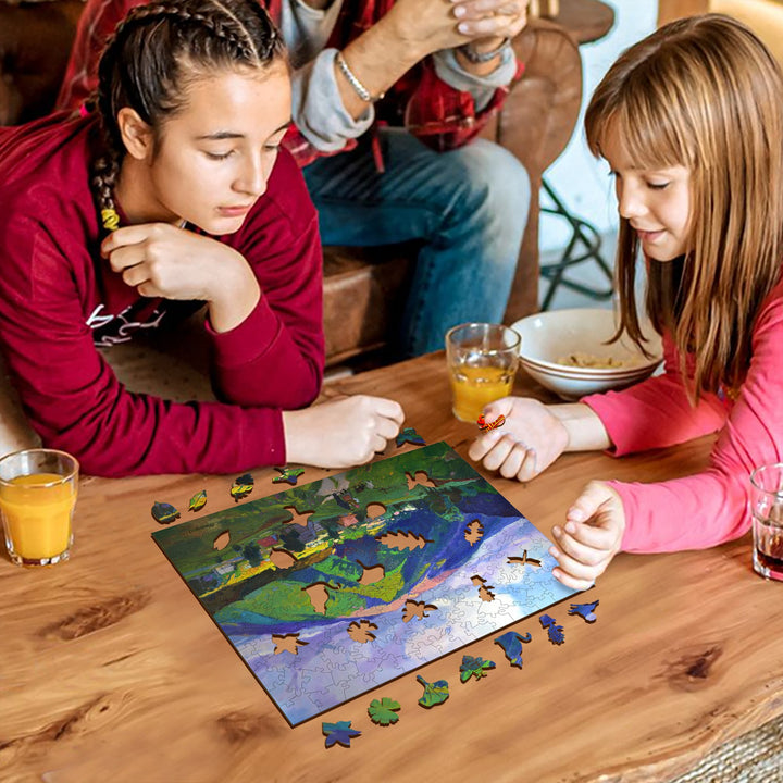 Two girls working on a colorful puzzle together on a wooden table, enjoying a fun and engaging activity.