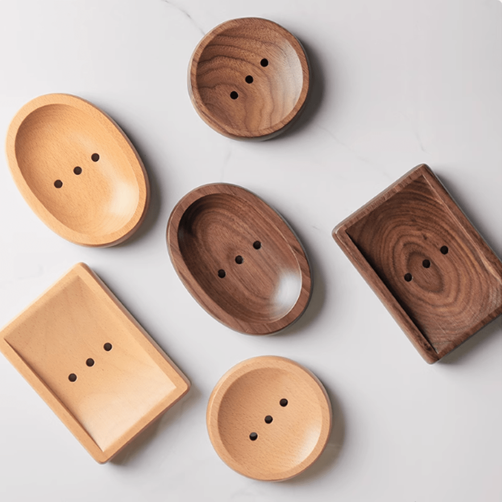 Stylish log-style soap boxes made of walnut and beech, perfect for bathroom decor and practical use.