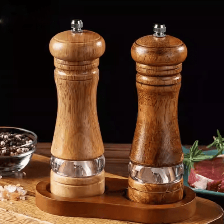 Two-tone spice grinder set made of natural rubberwood, stylishly enhancing your dining experience.