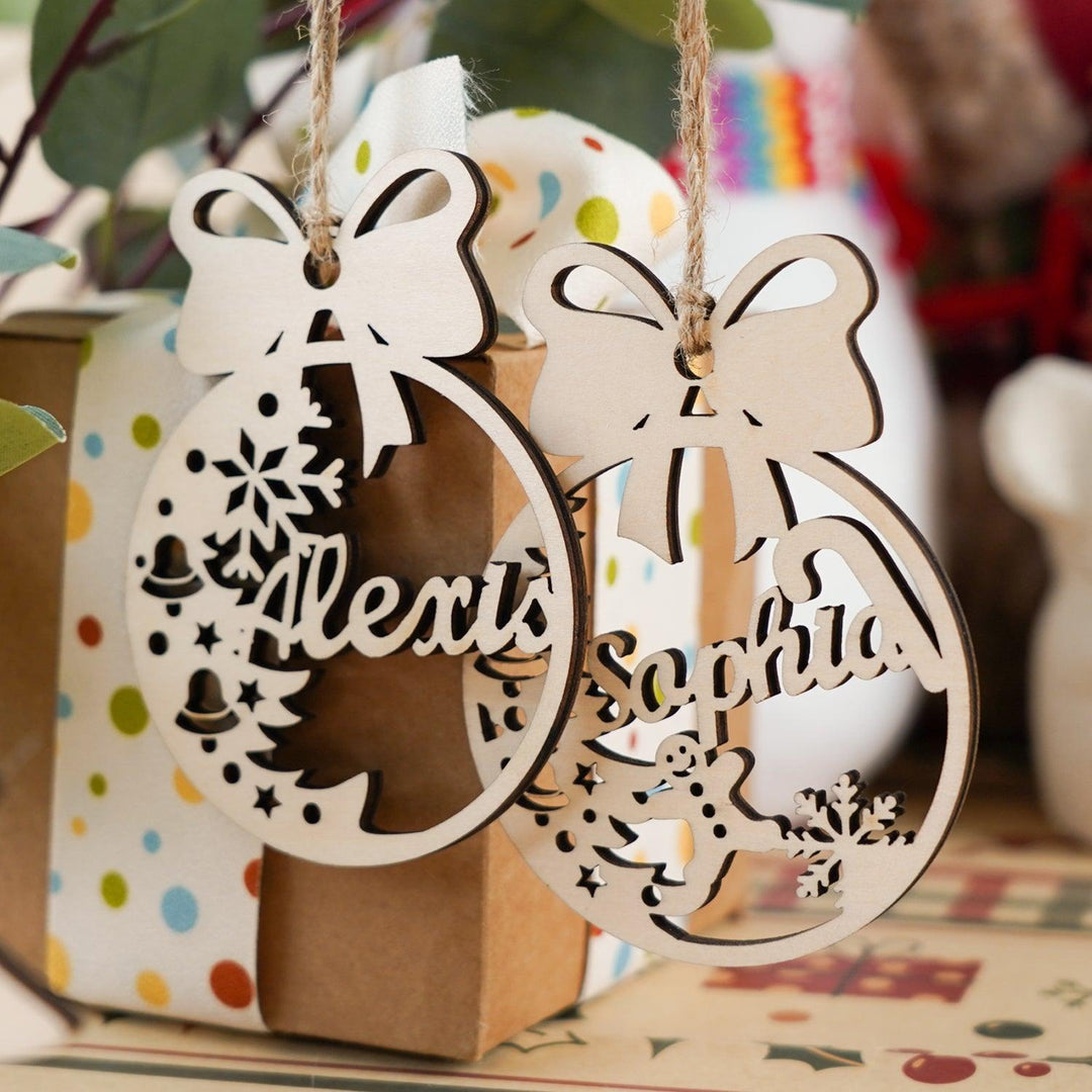 Personalized wooden Christmas ornaments featuring names and festive designs, perfect for tree decorations.