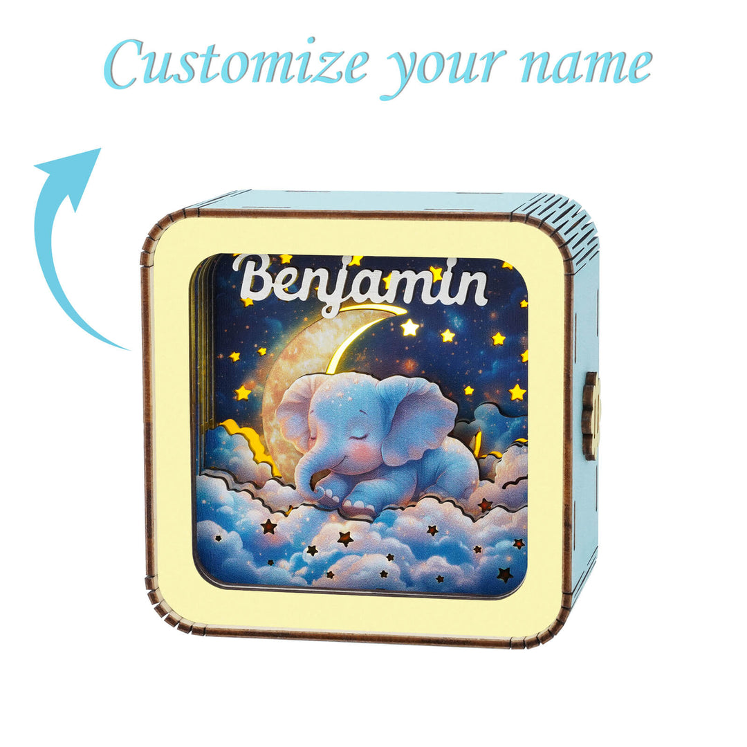 Personalized 3D wooden night light featuring a sleeping elephant design, customizable with the name Benjamin.
