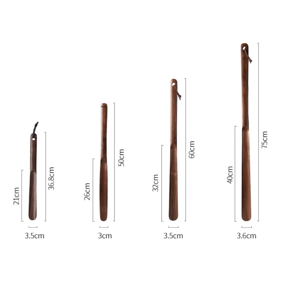 Variety of walnut shoe horns in different sizes, showcasing natural wood and ergonomic design.