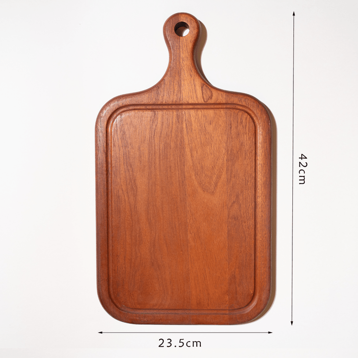 Ebony cutting board with built-in juice groove, 42cm x 23.5cm, ideal for cooking and kitchen decoration.