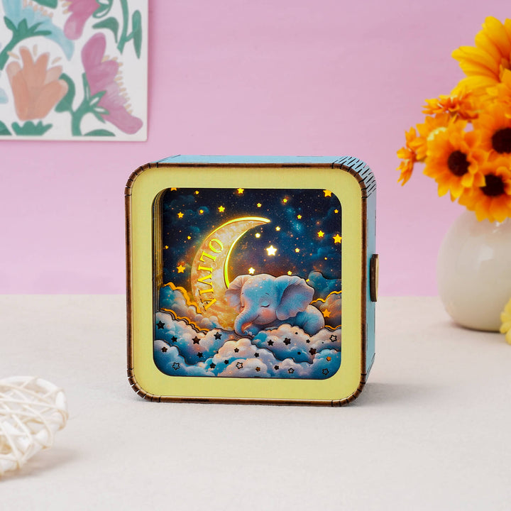 3D wooden puzzle night light featuring a dreamy elephant design with moon and stars, perfect for home decor.
