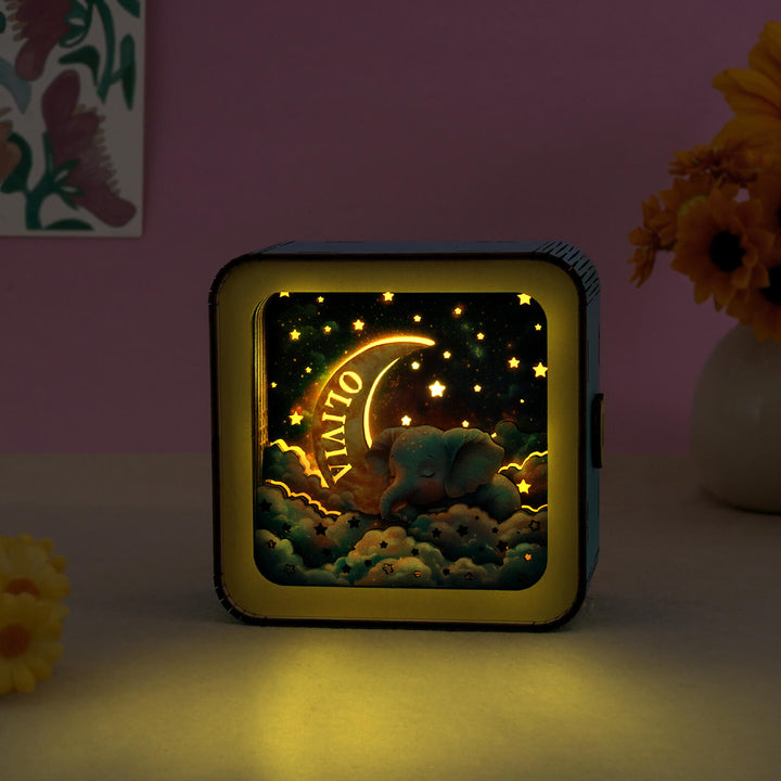 3D wooden puzzle night light with elephant design and stars, personalized glow for home decor.