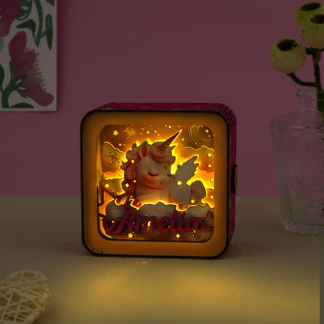 Personalized 3D wooden unicorn night light with the name Amelia, glowing softly in a cozy room.