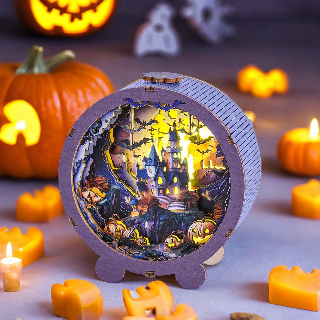 3D wooden puzzle night light featuring a Halloween castle with pumpkins and eerie decorations.