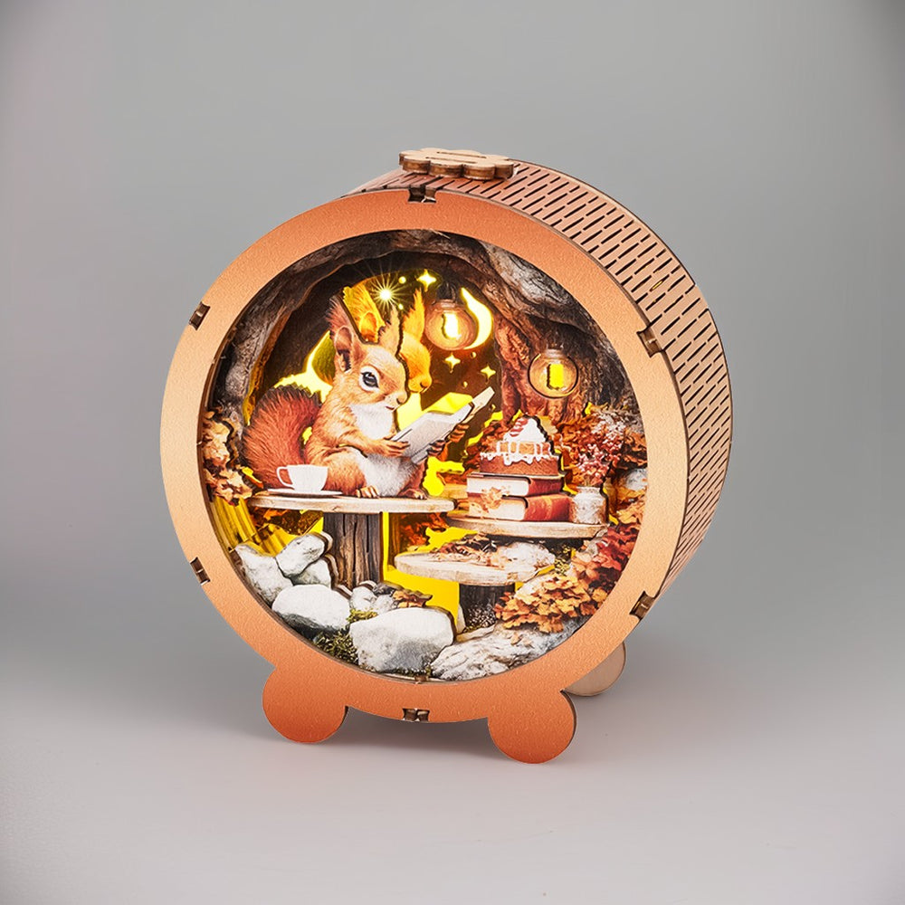 3D wooden puzzle night light featuring a squirrel reading, surrounded by autumn foliage and a cozy setting.