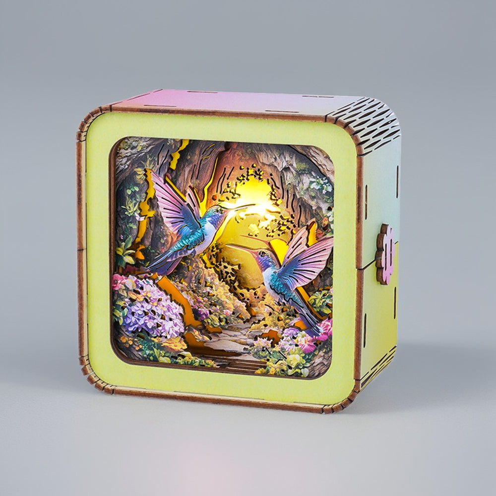 3D wooden puzzle night light featuring colorful hummingbirds and a vibrant natural scene.
