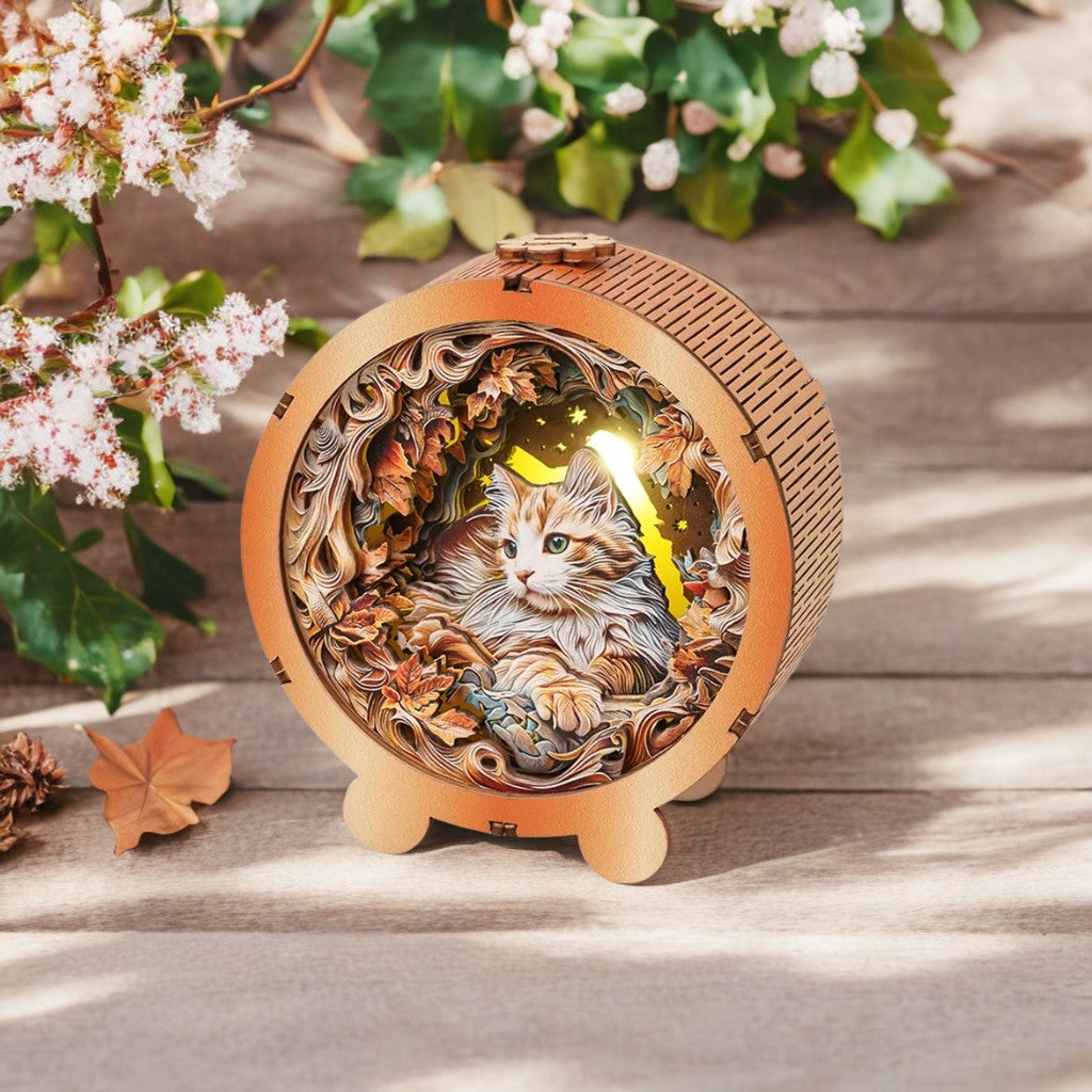 3D wooden puzzle night light featuring a mystical cat surrounded by colorful autumn leaves.