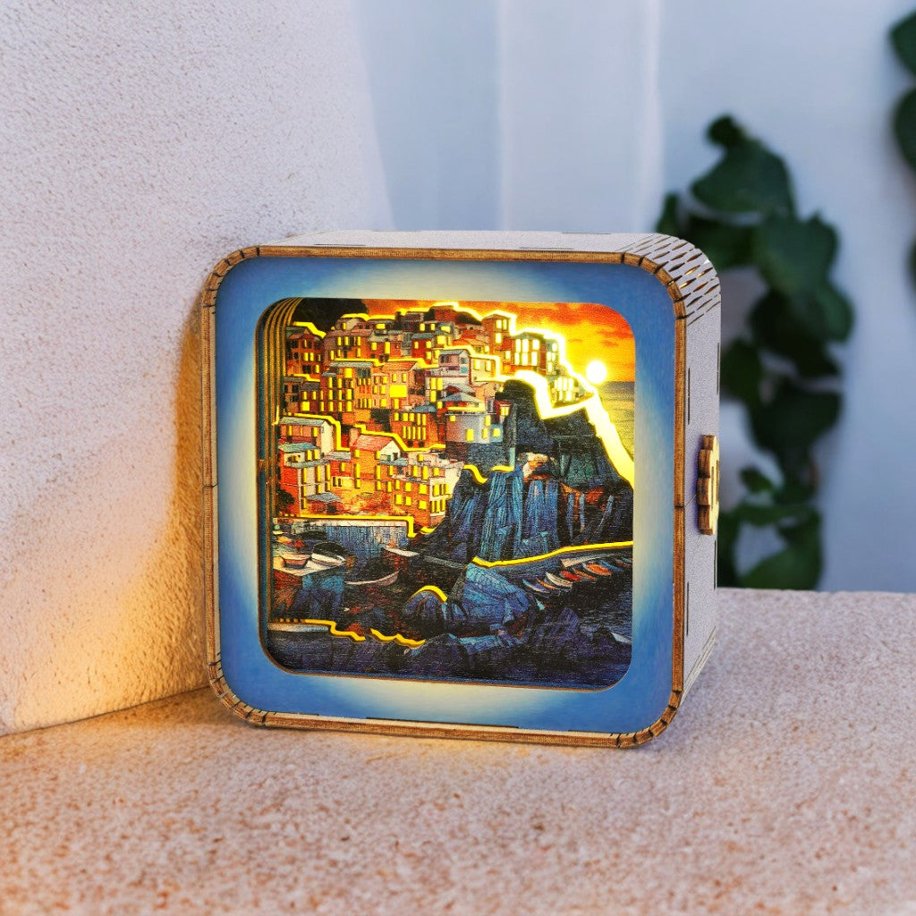 Golden Coast Village 3D wooden puzzle night light illuminating a colorful coastal town design.