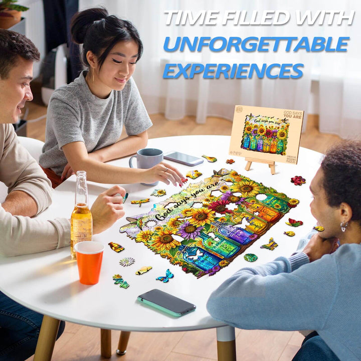 Three friends enjoying the God Says You Are wooden jigsaw puzzle at a table, highlighting fun and focus.